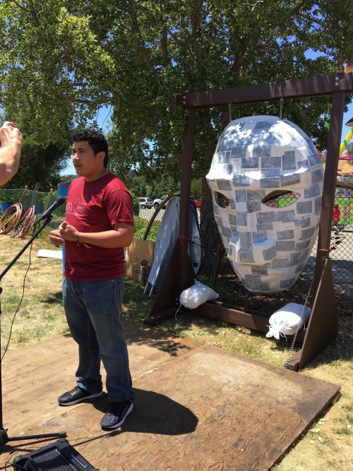 Alejandro Lopez with the Poetry Mask he created with ForWords Literacy Lab students